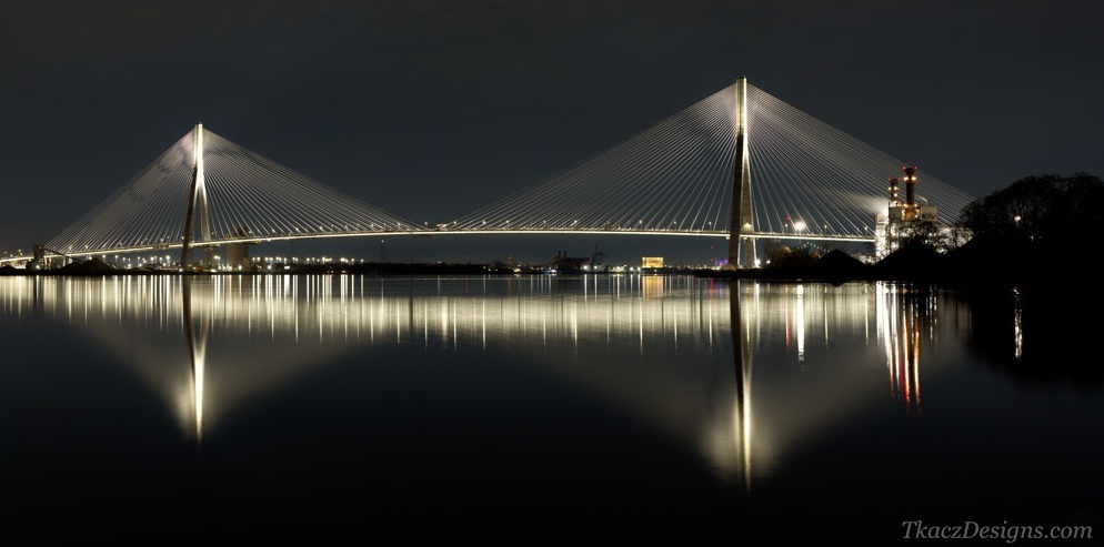 Long exposure night photograph of Gordie Howe International Bridge over Detroit River by Peter Tkacz